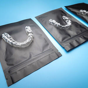 clear aligners on black bags