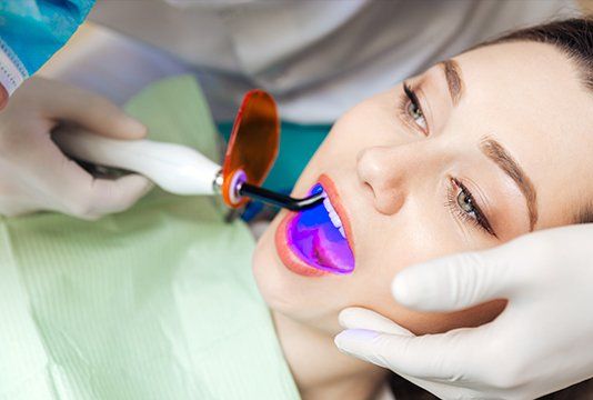 Woman receiving dental bonding