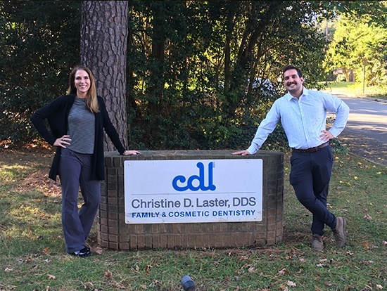 Raleigh North Carolina dentists Brandon Rensch D D S and Christine Laster D D S outside of dental office