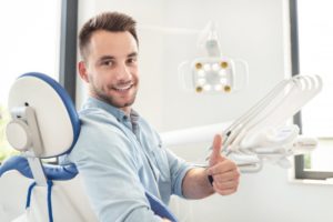 man giving thumbs up after debunking cosmetic dentistry myths 