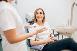 woman talking to dentist about her teeth