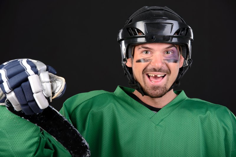 A hockey player missing teeth